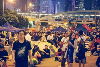 High angle view of people standing on road