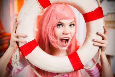 Close-up portrait of smiling young woman