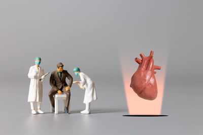 Close-up of figurines against white background