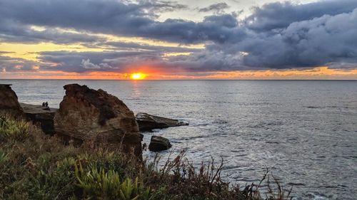 Scenic view of sea against sky during sunset