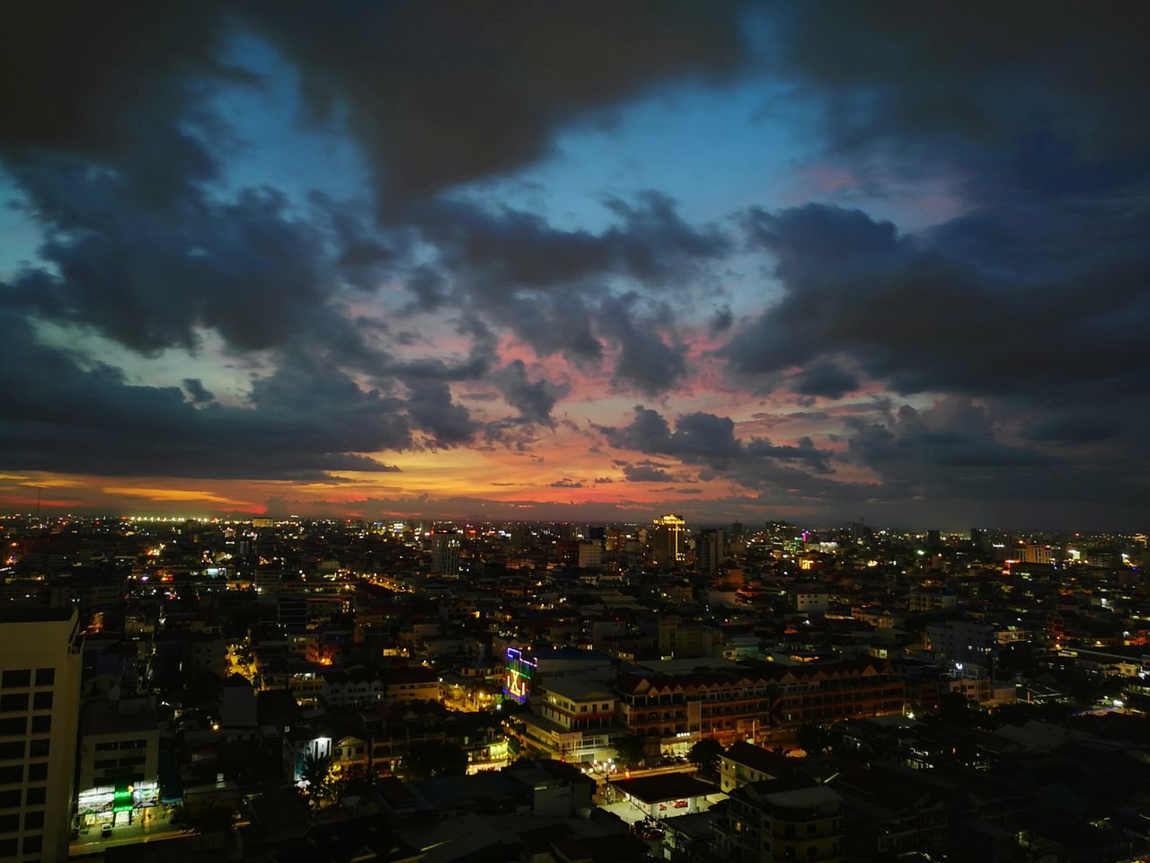 illuminated, architecture, cityscape, sky, building exterior, built structure, no people, cloud - sky, city, sunset, night, modern, travel destinations, outdoors, skyscraper, beauty in nature, nature