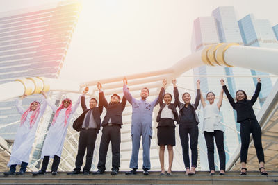 Group of people against built structure