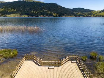 High angle view of pier over lake against sky