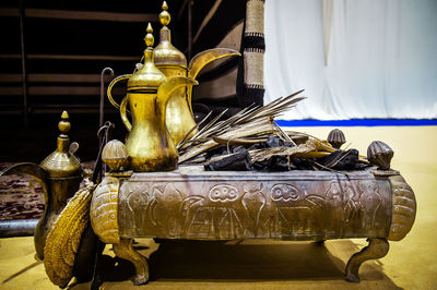 Close-up of electric lamp on table at home