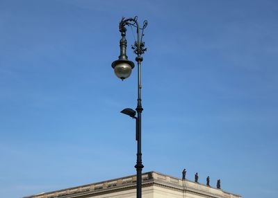 Low angle view of street light against sky