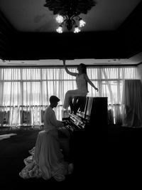 Woman playing piano at music concert