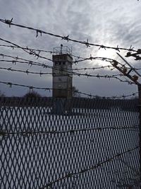 Chainlink fence against sky