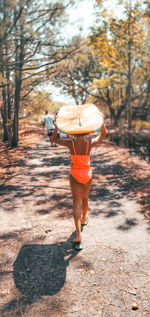 Rear view of woman walking on street