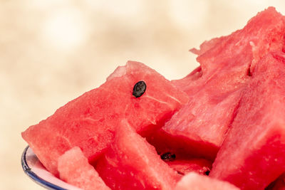 Close-up of strawberry on red cake