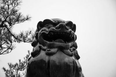 Close-up of a statue against clear sky