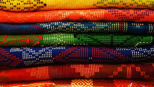 Close-up of colorful fabrics stack