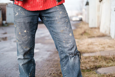 Low section of man standing outdoors