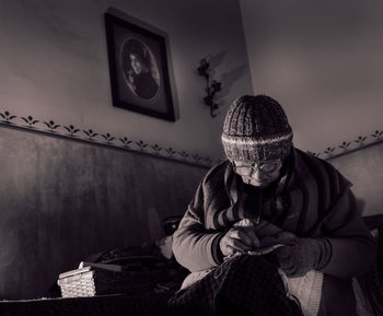 Woman weaving at home