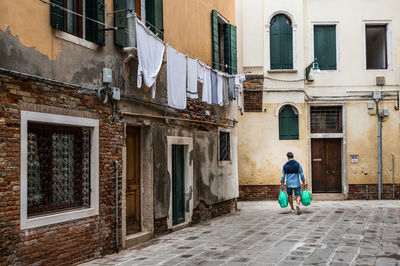 Rear view of woman walking on street