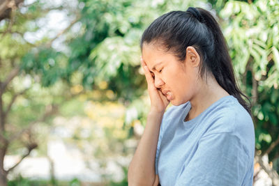 Close-up of a girl looking away outdoors