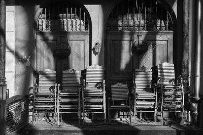 Stack of chairs in building