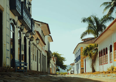 Street amidst buildings against sky