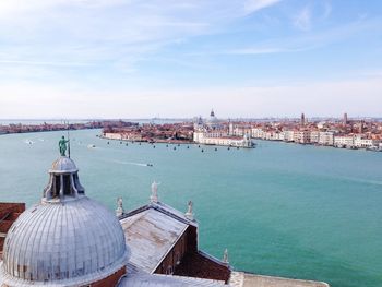 Santa maria della salute seen from church of san giorgio maggiore against sky