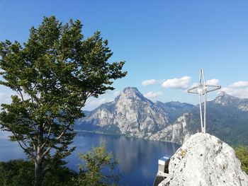 Scenic view of lake and mountains against sky