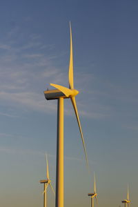 Low angle view of wind turbine against sky