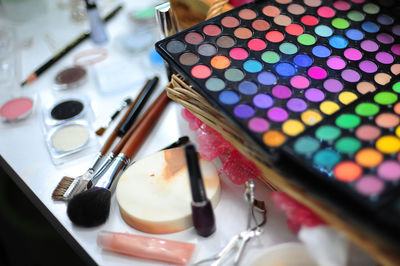 High angle view of make-up cosmetics on table