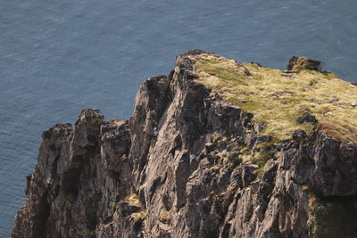 High angle view of rock formations on sea shore