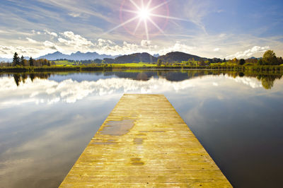 Wooden jetty pier in beautiful lake