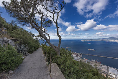 Road by sea against sky