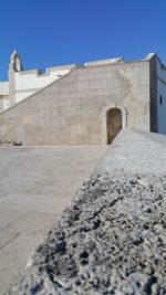 Stone wall against clear sky