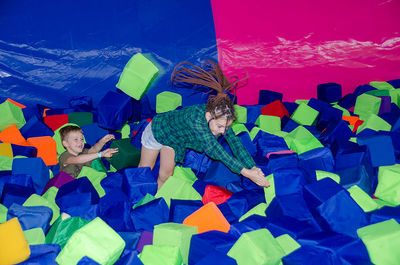 High angle view of people holding colorful balloons