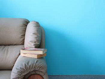 Low section of person on sofa at home