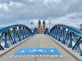 View of bridge against cloudy sky