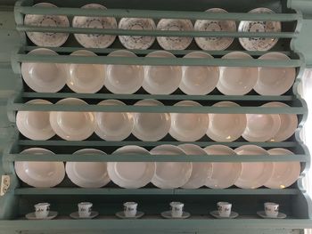 Stack of multi colored lights on shelf