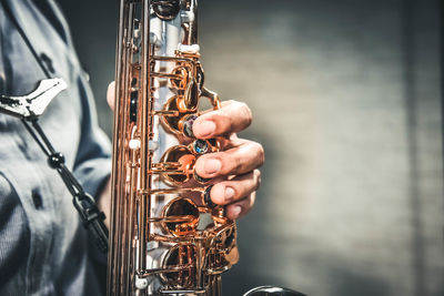 Close-up of man playing instrument