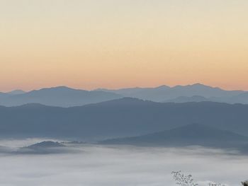 Scenic view of mountains against sky during sunset