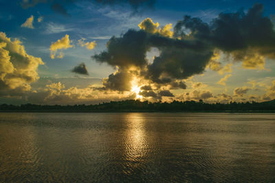 Scenic view of lake against sky during sunset