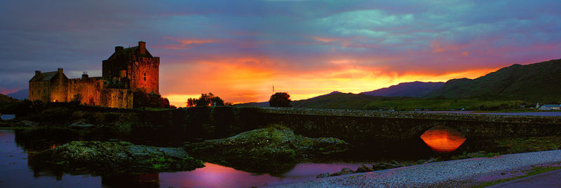 Scenic view of river at sunset