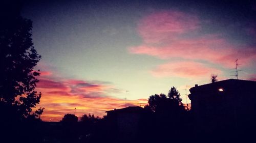 Low angle view of silhouette trees against sky during sunset