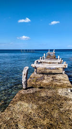 Pier over sea against sky