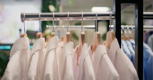 Close-up of clothes hanging on rack