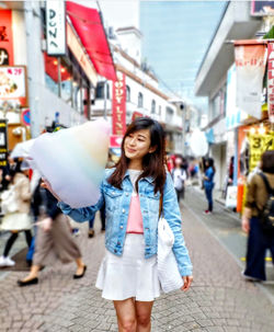 Young woman walking on street in city japan young lady shopping dress posting