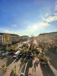 High angle view of road by buildings against sky