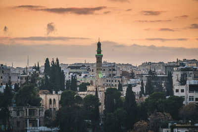 Cityscape with minaret at sunset