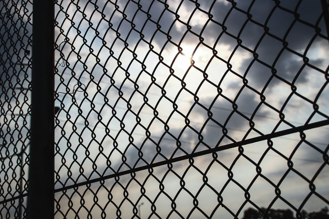 full frame, pattern, backgrounds, metal, design, indoors, chainlink fence, fence, built structure, architecture, protection, repetition, grid, metal grate, glass - material, window, safety, close-up, geometric shape, no people