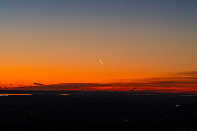 Scenic view of silhouette landscape against romantic sky at sunset