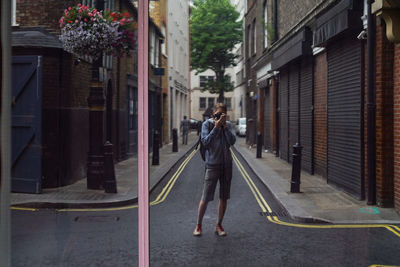 Man photographing at camera