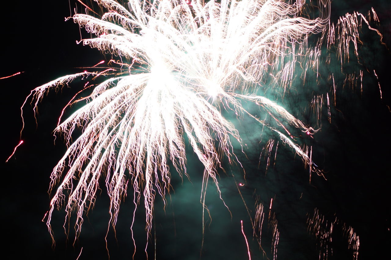 exploding, firework display, long exposure, low angle view, celebration, sparks, multi colored, night, motion, firework - man made object, illuminated, blurred motion, sky, outdoors, no people, arts culture and entertainment, event, firework