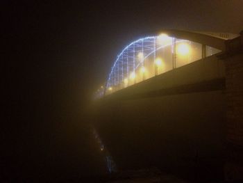 Low angle view of light trails at night