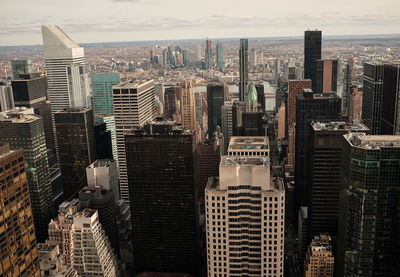 Aerial view of modern buildings in city against sky