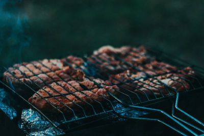 Close-up of meat on barbecue grill